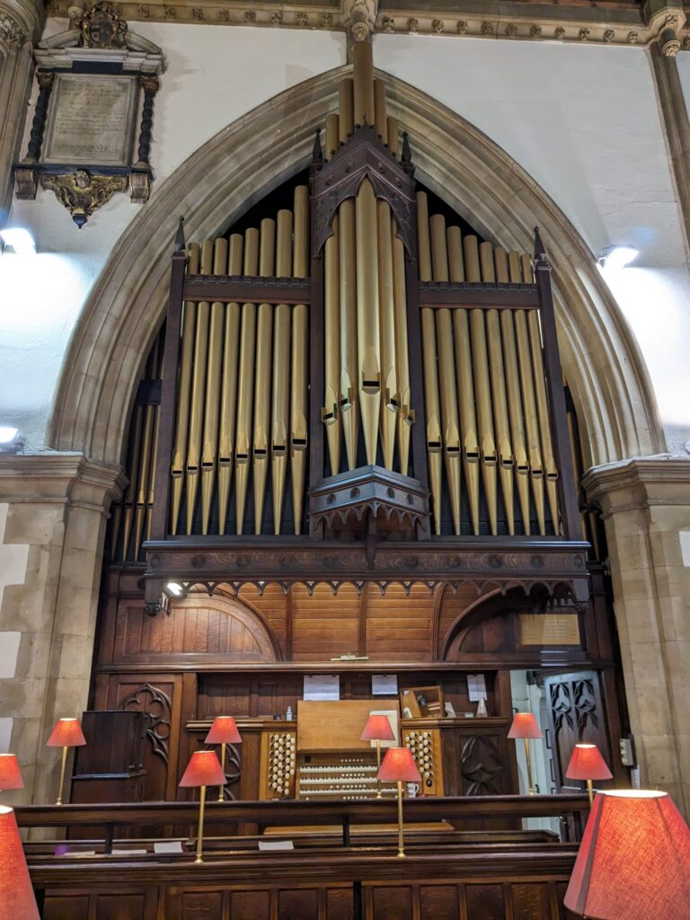 The organ casing, and three manual organs behind the choir stalls
